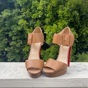 Christian Louboutin’s worn once.Tan high heel